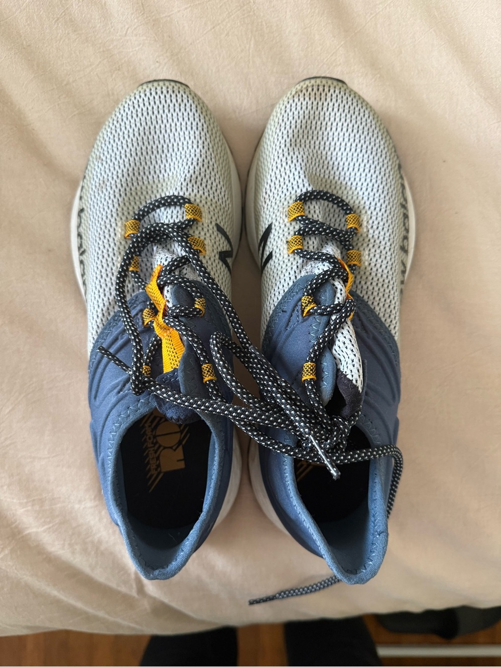 New Balance Men's White & Navy Athletic Sneakers with Yellow Accents